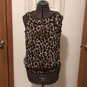 B. Wear Animal Print Sleeveless Blouse